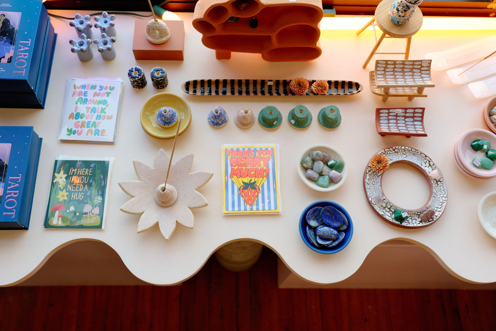 Elegant stationery and desk supplies, including notebooks, pens, and organizers, arranged neatly on a table.