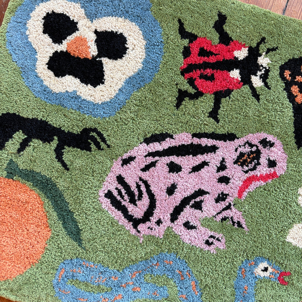 Colorful rug with animal designs on a wooden floor